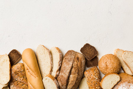Homemade natural breads. Different kinds of fresh bread as background, top view with copy space.の写真素材