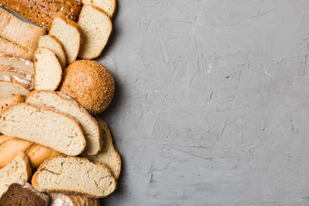 Homemade natural breads. Different kinds of fresh bread as background, top view with copy space.の写真素材