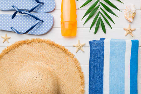 Summer vacation concept flat lay. beach accessories and towel top view. Space for text. travel...