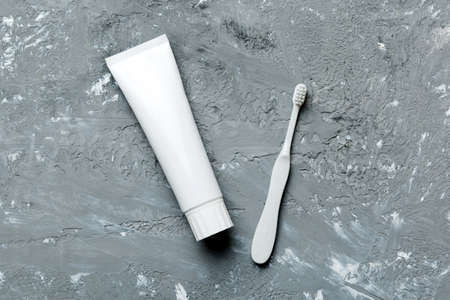 toothpaste and toothbrush top view with copy space on colored background. flat lay. dental hygiene....