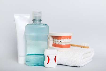 Mouthwash and other oral hygiene products on colored table top view with copy space. flat lay....