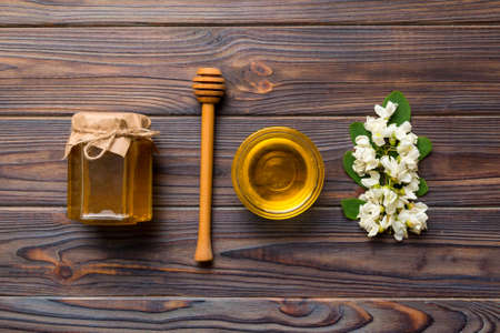 honey jar with acacia flowers and leaves. fresh honey top view flat lay.の写真素材