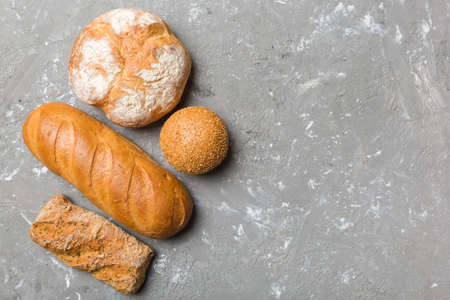 Homemade natural breads. Different kinds of fresh bread as background, top view with copy space.