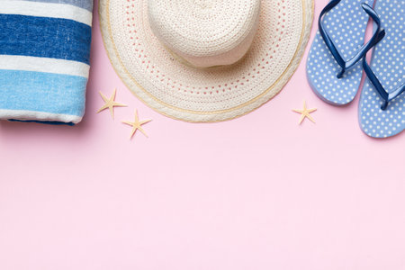 Summer vacation concept flat lay. straw hat beach accessories and towel top view. Space for text. travel concept.の写真素材