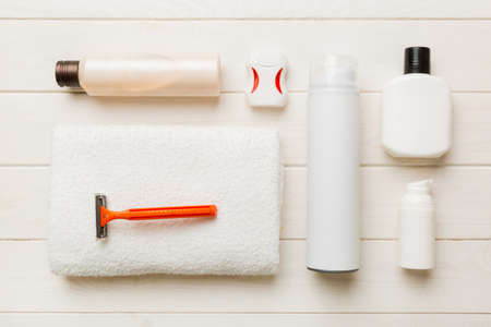 Mockup for bathing products top view flat lay, spa razor, toothpaste, soap, gel and other various...