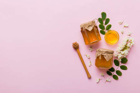 honey jar with acacia flowers and leaves. fresh honey top view flat lay.の写真素材