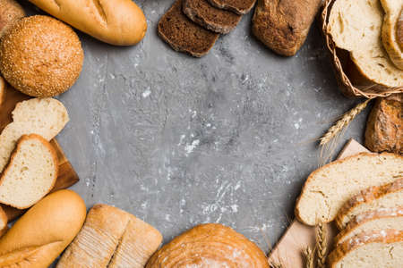 Homemade natural breads. Different kinds of fresh bread as background, top view with copy space.