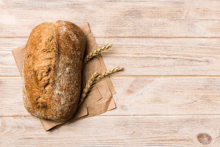 Fresh Homemade Whole Wheat Bread. bread on napkin on rustic background, fresh bread top view.
