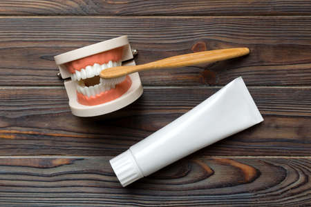 Mouthwash and other oral hygiene products on colored table top view with copy space. flat lay. dental hygiene. oral care kit. Dentist concept.の写真素材