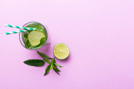 Caipirinha, Mojito cocktail, vodka or soda drink with lime, mint and straw on table background....