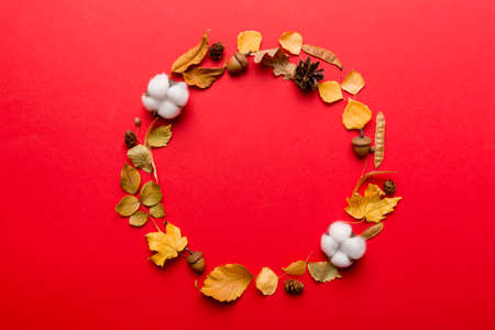 Autumn composition made of dried leaves, cones and acorns on table. Flat lay, top view.