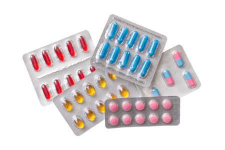 Group of blister capsule pills on isolated white background top view.