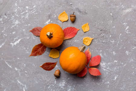 autumn composition. Pattern made of dried leaves and other design accessories on table. Flat lay,...