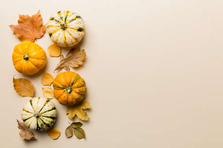 autumn composition. Pattern made of dried leaves and other design accessories on table. Flat lay,...