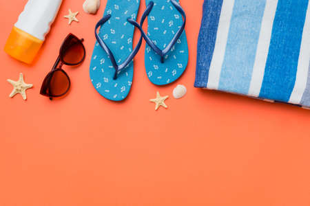 Summer vacation concept flat lay. straw hat beach accessories and towel top view. Space for text. travel concept.の写真素材
