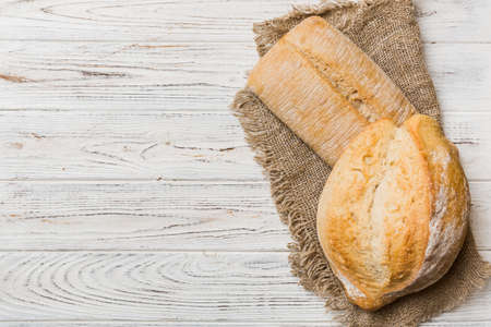 Assortment of freshly baked bread with napkin on rustic table top view. Healthy unleavened bread....