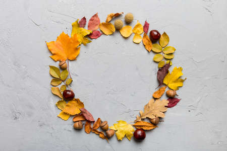 Autumn composition made of dried leaves, cones and acorns on table. Flat lay, top view.