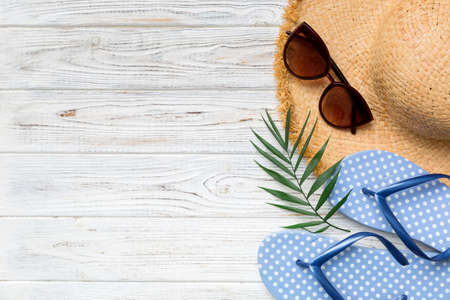 Summer vacation concept flat lay. straw hat beach accessories and towel top view. Space for text. travel concept.の写真素材