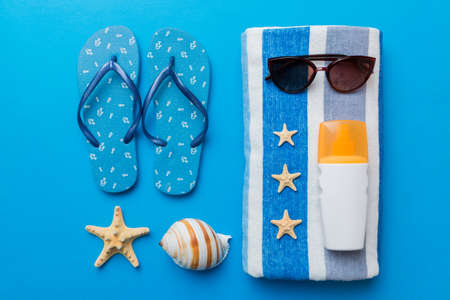 Summer vacation concept flat lay. beach accessories and towel top view. Space for text. travel...