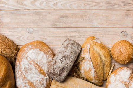 Homemade natural breads. Different kinds of fresh bread as background, top view with copy space.