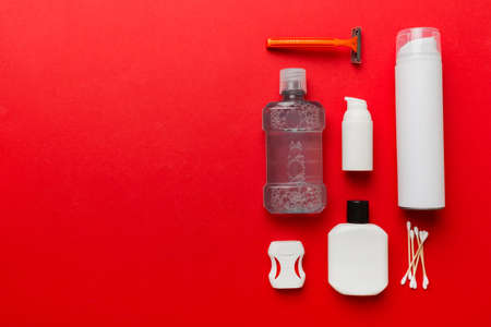 Composition with bath cosmetics on table. razor, toothpaste, soap, gel, toothbrush, mouthwash and other various accessories. Cosmetics for skin health. Bath Mockup for your logo.の写真素材