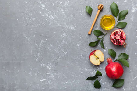 Flat lay composition with symbols jewish Rosh Hashanah holiday attributes on colored background, Rosh hashanah concept. New Year holiday Traditional. Top view with copy space.の写真素材