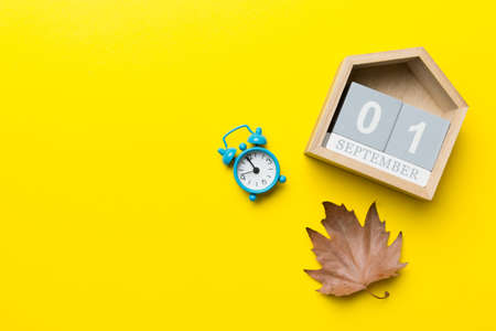 Calendar for September top view with copy space. Wooden calendar block with date 1 September with...