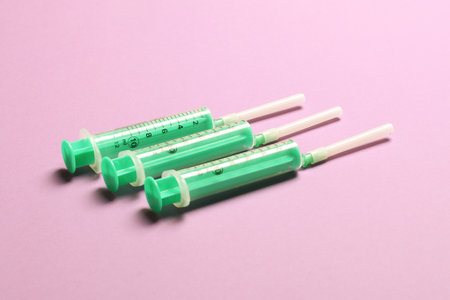 Top view of medical syringes on colorful background. Health care concept with copy space.の写真素材