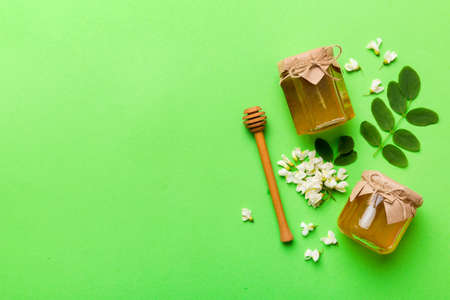 honey jar with acacia flowers and leaves. fresh honey top view flat lay.の写真素材