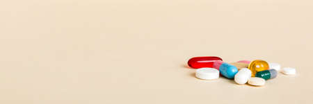 Many different colorful medications and pills perspective view. Set of many pills on colored background.の写真素材