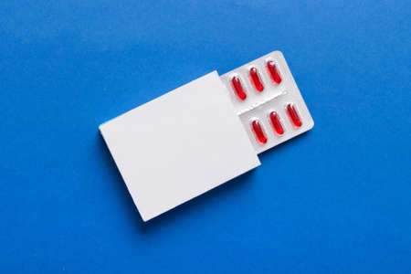 Blank White Product Package Box Mock-up. Open blank medicine drug box with Vatamin a blister top view.の写真素材