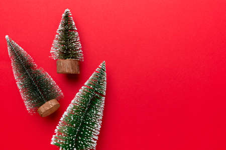Flat lay composition with christmas trees on color background. Top view with copy space.の写真素材