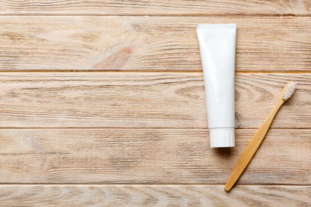 toothpaste and toothbrush top view with copy space on colored background. flat lay. dental hygiene....