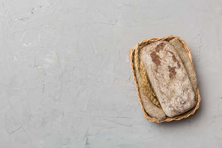 Freshly baked bread on basket against natural background. top view bread copy space.