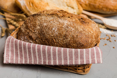 Homemade natural breads. Different kinds of fresh bread as background, perspective view with copy...