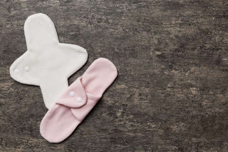 Eco-friendly reusable fabric women's pads. set of colorful bright reusable menstrual pads. zero waste woman periods concept top view with copy space.の写真素材