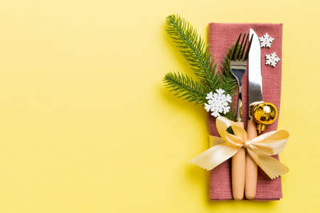 Christmas table place setting with knife, napkin and fork. Holidays new year background with copy...