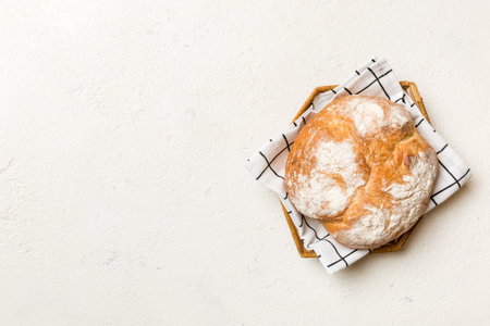 Freshly baked bread on basket against natural background. top view bread copy space.の写真素材