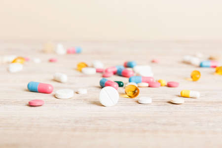 Collection Of Various Medical Tablets And Pills. Assorted pharmaceutical medicine pills, tablets and capsules on table background. Heap of assorted various medicine tablets. health care.の写真素材