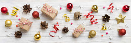 New Year composition. Christmas decor background with pine cones. Top view with copy space.