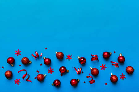 christmas composition. a pattern of christmas balls on colored background. Flat lay, top view New...