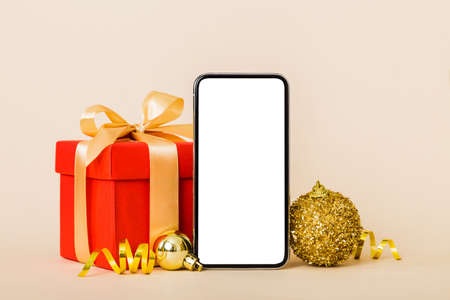 Digital phone mock up with rustic Christmas decorations for app presentation with empty space for...