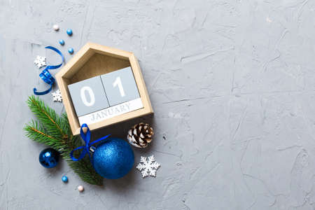 Christmas calendar 1 january. Christmas gift, fir branches, pine cones. Flat lay, top view. New Year...