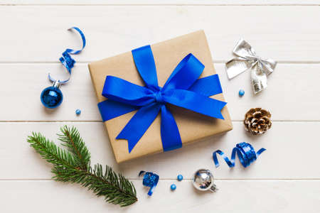 Top view Flat lay Christmas decorations and gift box on colored background with copy space. Christmas or Happy New Year composition.の写真素材