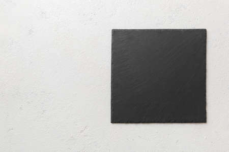top view of empty black slate plate on cement background. Empty space for your design.の写真素材