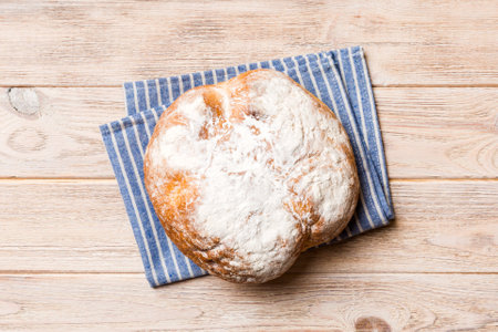 Fresh homemade crisp round bread on napkin, top view. Healthy unleavened bread. French bread. Top...