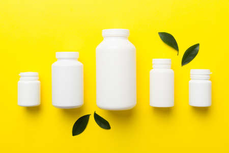 supplement pills with medicine bottle health care and medical top view. vitamin tablets. Top view...