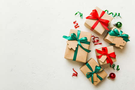 wrapped christmas or other holiday handmade present in paper with colored ribbon. Present box,...