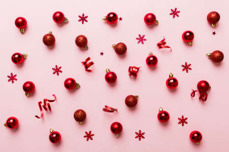 christmas composition. a pattern of christmas balls on colored background. Flat lay, top view New year decor.の写真素材