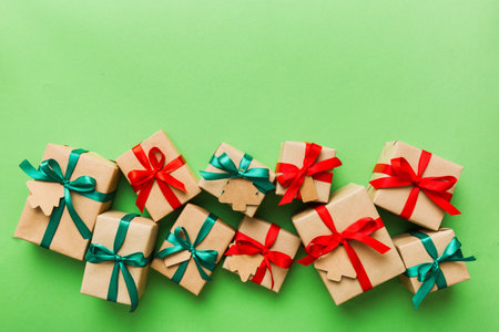 wrapped christmas or other holiday handmade present in paper with colored ribbon. Present box,...